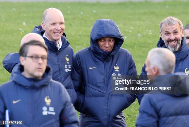 France's forward Kylian Mbappe arrives for a training session ahead of the national team's friendly football match against Scotland at the LOSC...