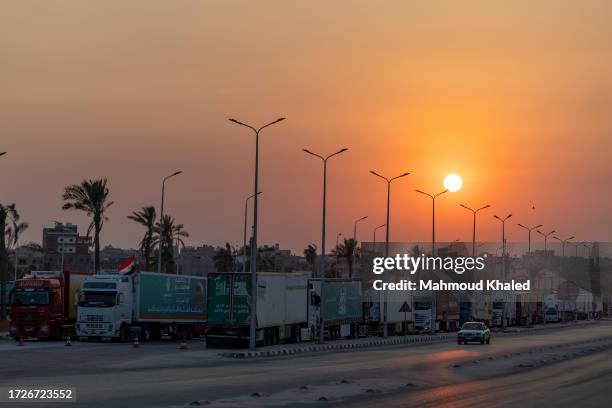 Aid convoy trucks loaded with supplies are seen at Arish City waiting for the Gaza-Egypt border to open on 15 October, 2023 in North Sinai, Egypt....