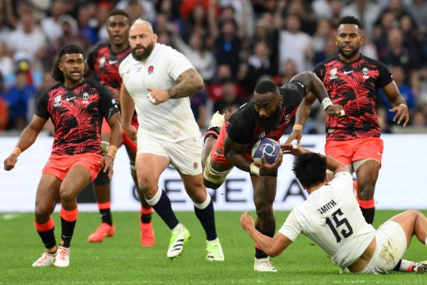 Fiji's left wing Semi Radradra is tackled by England's full-back Marcus Smith during the France 2023 Rugby World Cup quarter-final match between...