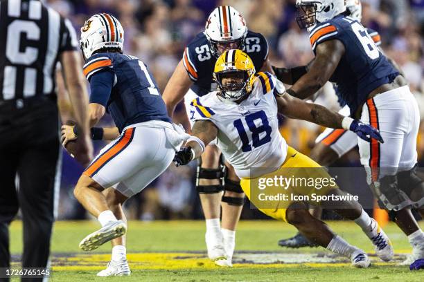 Tigers defensive tackle Mekhi Wingo sacks Auburn Tigers quarterback Payton Thorne during a game between the LSU Tigers and the Auburn Tigers on...