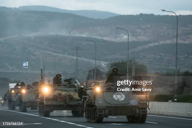 Israeli armored personnel carriers move in formation near the border with Lebanon on October 15, 2023 in Amiad, Israel. Israel has sealed off Gaza...