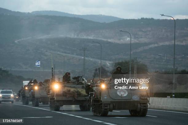 Israeli armored personnel carriers move in formation near the border with Lebanon on October 15, 2023 in Amiad, Israel. Israel has sealed off Gaza...