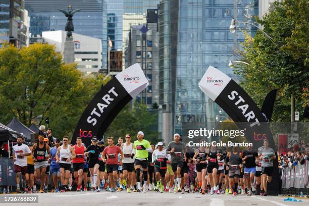Runners make their way out of the starting gate during the Toronto Waterfront Marathon on October 15, 2023 in Toronto, Canada.
