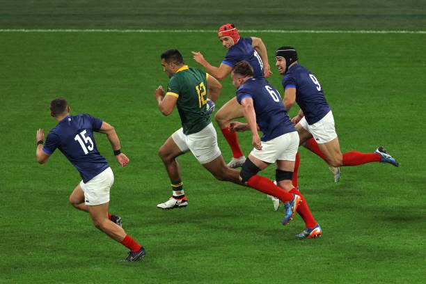 South Africa's inside centre Damian de Allende is persued by France's defenders during the France 2023 Rugby World Cup quarter-final match between...