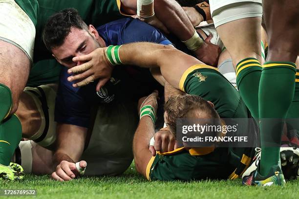 France's flanker Charles Ollivon tussles with South Africa's number eight Duane Vermeulen during the France 2023 Rugby World Cup quarter-final match...