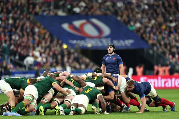 France's scrum-half and captain Antoine Dupont looks on as a scrum forms during the France 2023 Rugby World Cup quarter-final match between France...