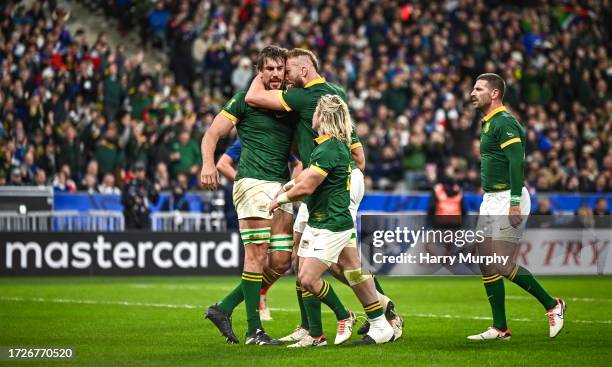 Paris , France - 15 October 2023; Eben Etzebeth of South Africa celebrates with team-mate RG Snyman after scoring his side's fourth try during the...