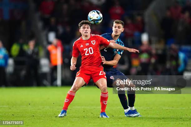 Wales' Daniel James and Croatia's Josip Stanisic battle for the ball during the UEFA Euro 2024 Qualifying Group D match at the Cardiff City Stadium,...
