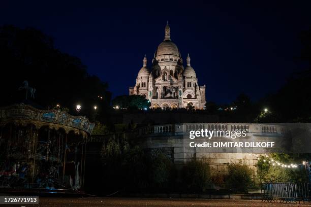 This photograph taken on October 15, 2023 shows the Sacre-Coeur Basilica at the Montmartre hill in Paris.