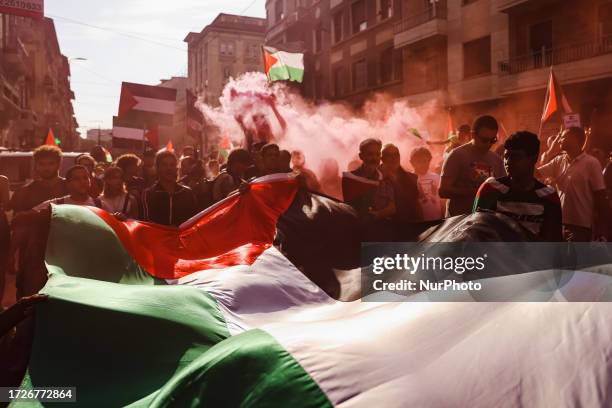 Demonstrators at the Milan for Palestine demonstration in support of the Palestinian population in Piazza Duca D'Aosta on October 14, 2023 in Milan,...