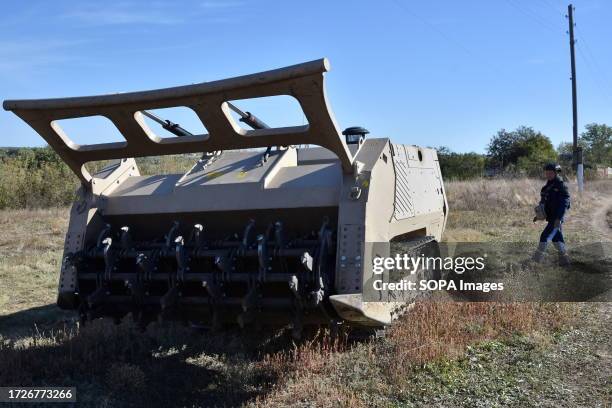 Ukrainian sapper operates the unmanned demining vehicle during the demining operation in Velyka Oleksandrivka. In March 2022, Velyka Oleksandrivka...