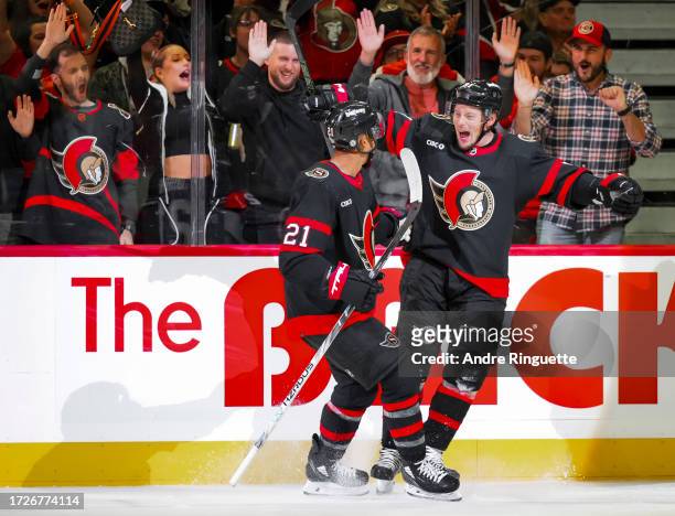 Vladimir Tarasenko of the Ottawa Senators celebrates his first period goal against the Tampa Bay Lightning with teammate Mathieu Joseph at Canadian...