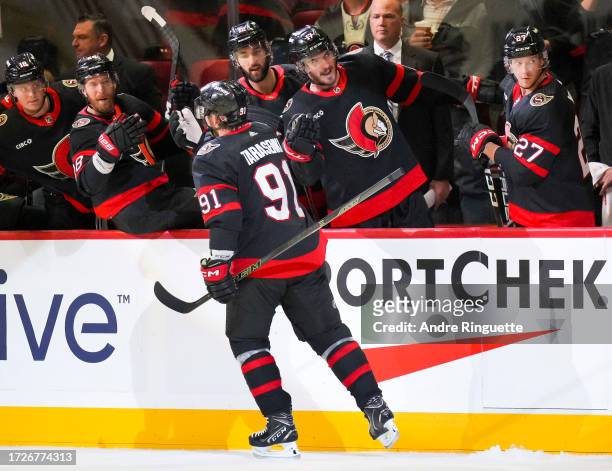 Vladimir Tarasenko of the Ottawa Senators celebrates his first period goal against the Tampa Bay Lightning with teammates at the players' bench at...