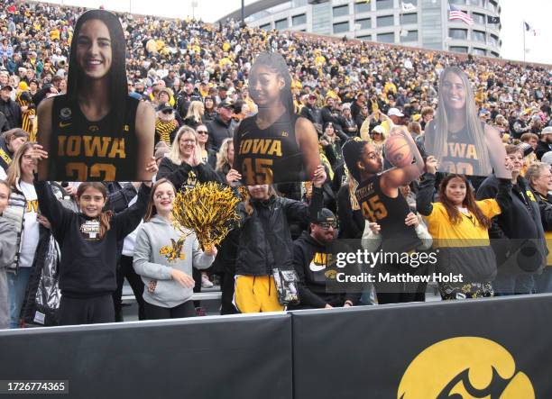 Fans cheer while attending the Crossover at Kinnick Event to watch the exhibition match-up between the Iowa Hawkeyes and the DePaul Blue Demons at...