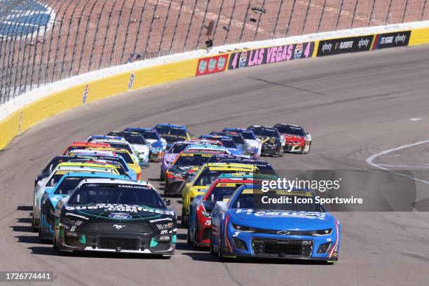 Brad Keselowski and Kyle Larson lead the field of cars up to the start line during the NASCAR Cup Series Playoff South Point 400 race Sunday, Oct. 15...