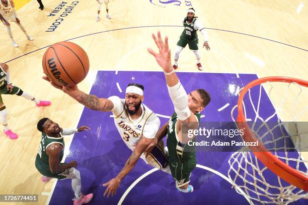 Anthony Davis of the Los Angeles Lakers drives to the basket during the game against the Milwaukee Bucks on October 15, 2023 at Crypto.Com Arena in...