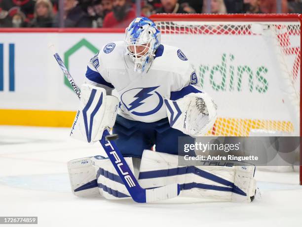 Making his NHL debut the Matt Tomkins of the Tampa Bay Lightning tracks the puck against the Ottawa Senators at Canadian Tire Centre on October 15,...