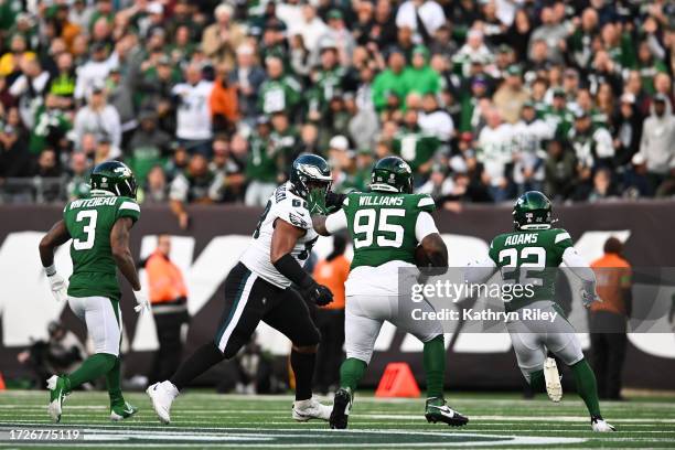 Quinnen Williams of the New York Jets intercepts a pass during the first half against the Philadelphia Eagles at MetLife Stadium on October 15, 2023...