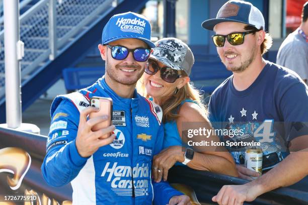 Kyle Larson takes a selfie with fans in Victory Lane after winning the South Point 400 NASCAR Cup Series Playoff race on October 15 Las Vegas Motor...