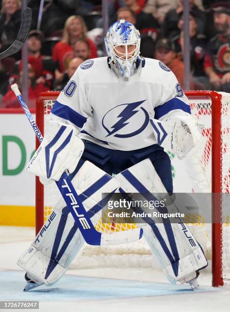 Making his NHL debut Matt Tomkins of the Tampa Bay Lightning tends net against the Ottawa Senators at Canadian Tire Centre on October 15, 2023 in...