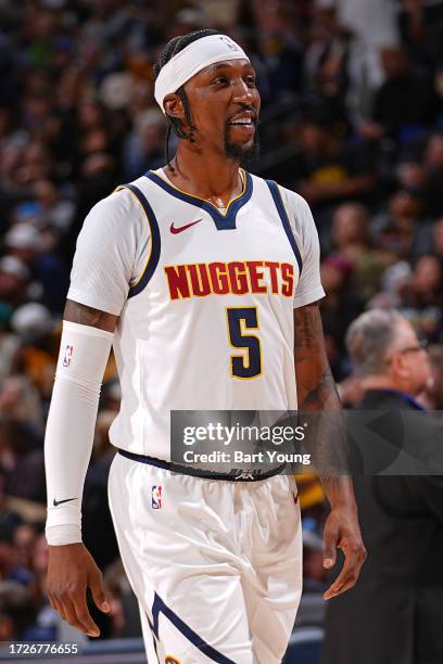 Kentavious Caldwell-Pope of the Denver Nuggets smiles during the game against the Chicago Bulls on October 15, 2023 at the Ball Arena in Denver,...