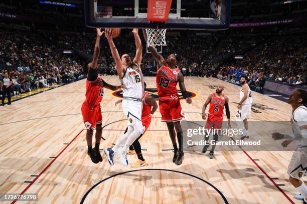 Nikola Jokic of the Denver Nuggets drives to the basket during the game against the Chicago Bulls on October 15, 2023 at the Ball Arena in Denver,...