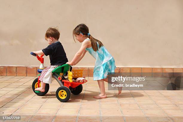 push me - tricycle stock pictures, royalty-free photos & images