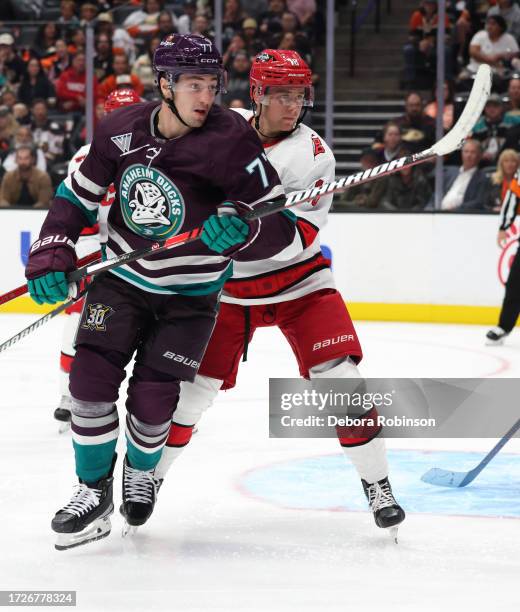 Frank Vatrano of the Anaheim Ducks battles against Jack Drury of the Carolina Hurricanes during the game on October 15, 2023 at Honda Center in...