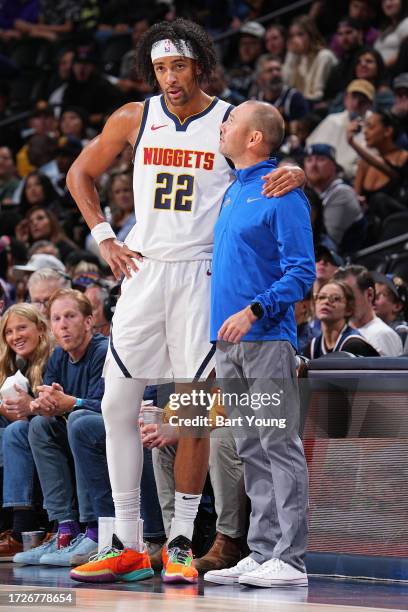 Zeke Nnaji of the Denver Nuggets and Head Coach Michael Malone of the Denver Nuggets during the game against the Chicago Bulls on October 15, 2023 at...