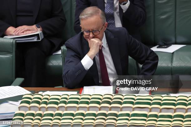 Australian Prime Minister Anthony Albanese reacts during Question Time in the House of Representatives at Parliament House in Canberra on October 16,...