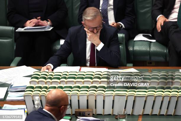 Australian Prime Minister Anthony Albanese reacts during Question Time in the House of Representatives at Parliament House in Canberra on October 16,...