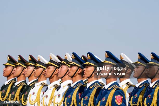 Honour guards wait for the arrival of Congo's President Denis Sassou Nguesso at Beijing Capital International Airport ahead of the Third Belt and...