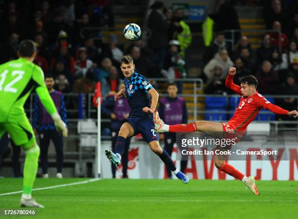 Croatia's Josip Stanisic crosses the ball into the box during the UEFA EURO 2024 European qualifier match between Wales and Croatia at Cardiff City...