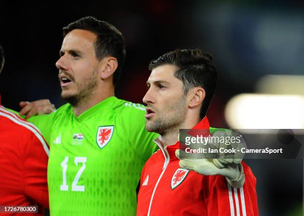 Wales' Ben Davies and Danny Ward during the national anthem during the UEFA EURO 2024 European qualifier match between Wales and Croatia at Cardiff...