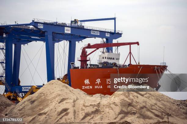 Gantry crane and the Zhen Hua 15 heavy load cargo carrier at the Vizhinjam transshipment container port, developed by Adani Ports and Special...