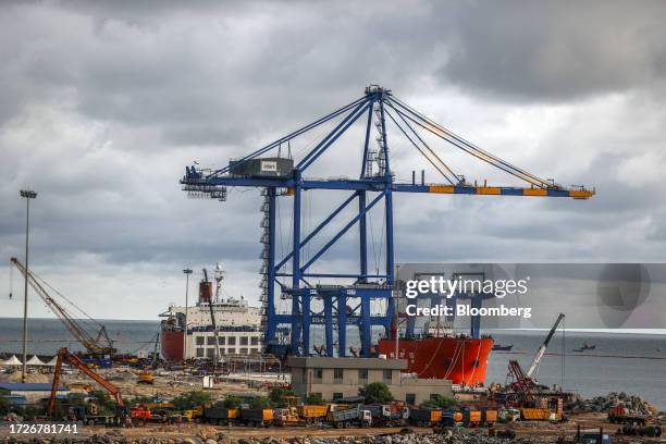 Gantry crane and the Zhen Hua 15 heavy load cargo carrier at the Vizhinjam transshipment container port, developed by Adani Ports and Special...