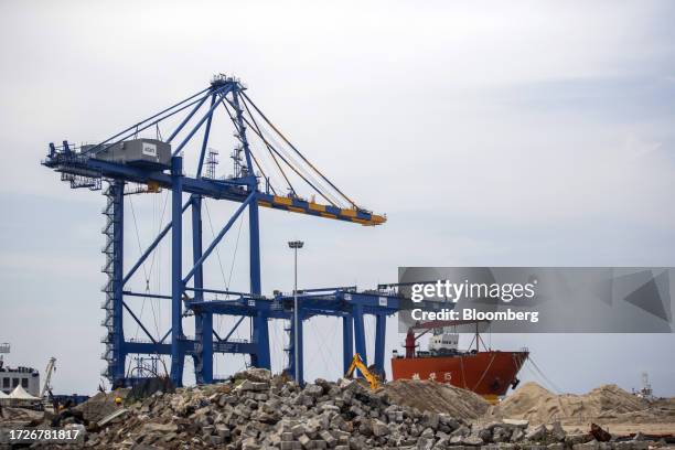 Gantry crane and the Zhen Hua 15 heavy load cargo carrier at the Vizhinjam transshipment container port, developed by Adani Ports and Special...