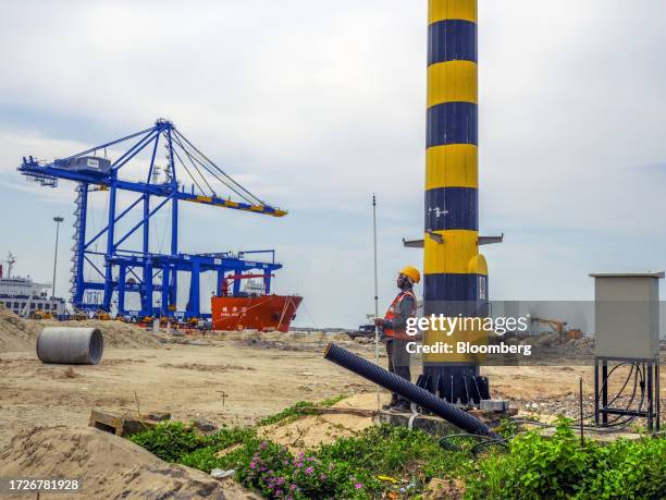 Gantry crane and the Zhen Hua 15 heavy load cargo carrier at the Vizhinjam transshipment container port, developed by Adani Ports and Special...