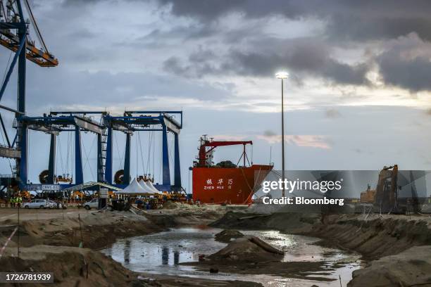 Gantry crane and the Zhen Hua 15 heavy load cargo carrier at the Vizhinjam transshipment container port, developed by Adani Ports and Special...