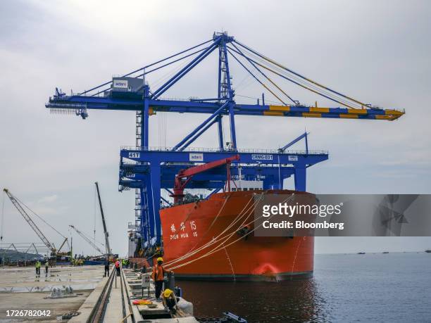 Gantry crane and the Zhen Hua 15 heavy load cargo carrier at the Vizhinjam transshipment container port, developed by Adani Ports and Special...