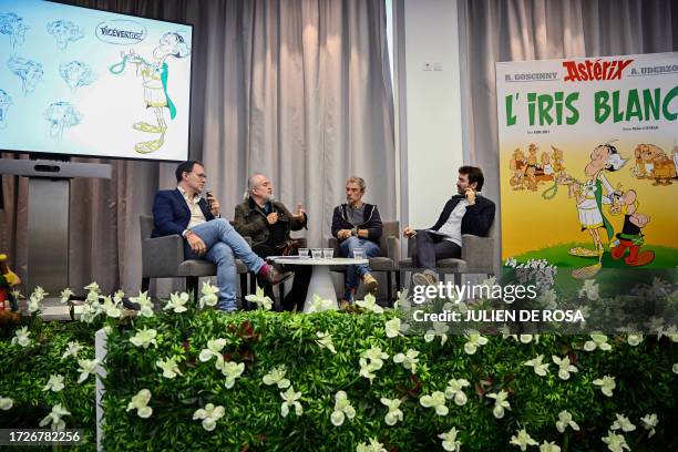 French cartoonist Didier Conrad and French writer Fabrice Caro speak during the presentation of the new "Asterix" comics album at the Hachette Livre...