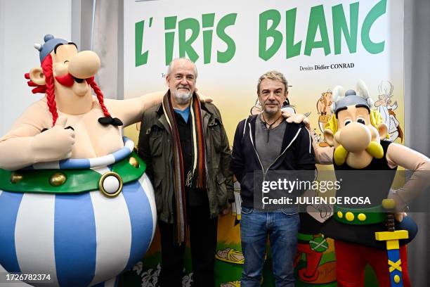 French cartoonist Didier Conrad poses with French writer Fabrice Caro after the presentation of the new "Asterix" comix album at the Hachette Livre...