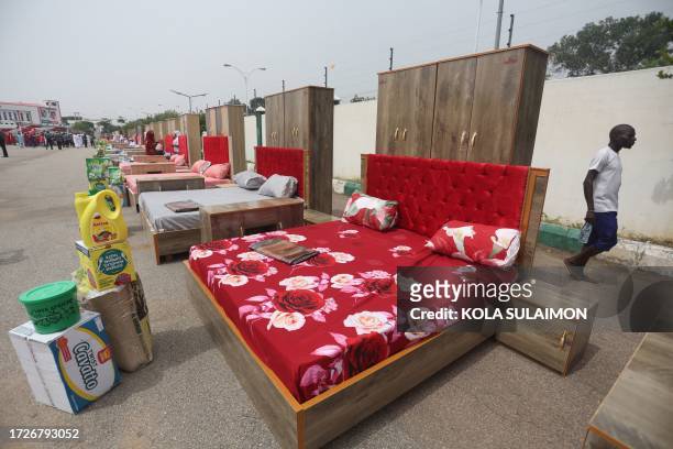 Household items given to couples are seen at the venue of a wedding reception at the Kano state governor's office after taking part in a mass wedding...