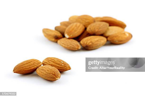 almonds - almonds isolated stock pictures, royalty-free photos & images