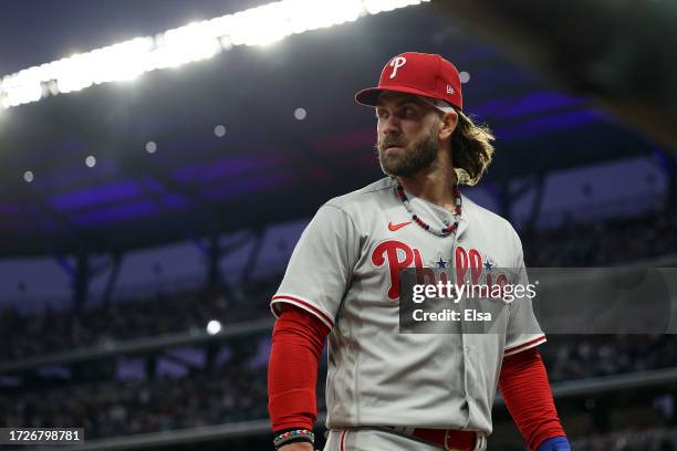 Bryce Harper of the Philadelphia Phillies walks back to the dugout in the fifth inning against the Atlanta Braves during Game Two of the Division...