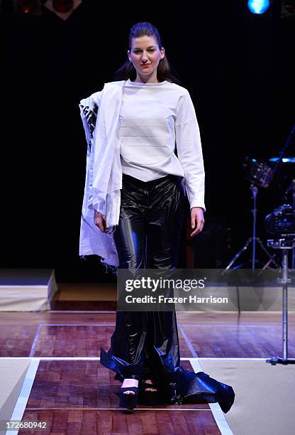 Model walks the runway at the Hochschule Pforzheim Show during Mercedes-Benz Fashion Week Spring/Summer 2014 at Landesvertretung Baden-Wuerttemberg...