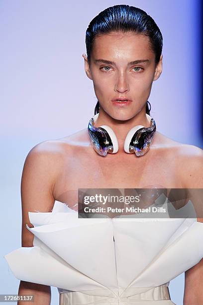 Model walks the runway at the Irene Luft Show during the Mercedes-Benz Fashion Week Spring/Summer 2014 at Brandenburg Gate on July 4, 2013 in Berlin,...