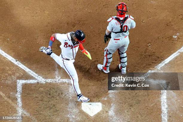 Ronald Acuna Jr. #13 of the Atlanta Braves scores in the sixth inning against the Philadelphia Phillies during Game Two of the Division Series at...