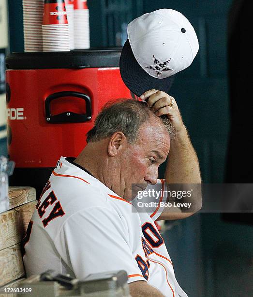 Dave Trembley of the Houston Astros reacts after Jordan Lyles of the Houston Astros throws a wild pitch allowing Yunel Escobar of the Tampa Bay Rays...