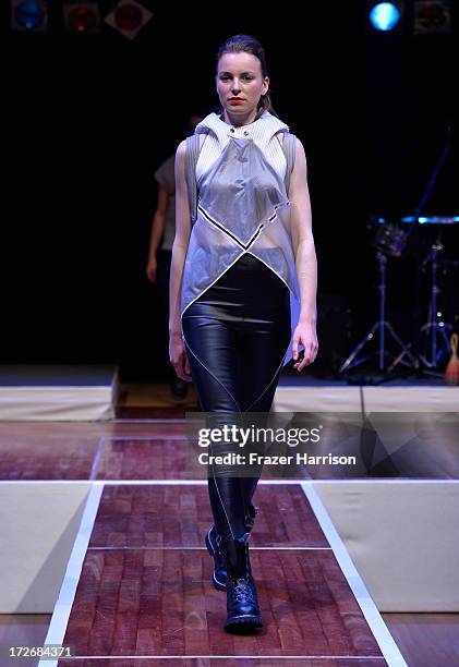 Model walks the runway at the Hochschule Pforzheim Show during Mercedes-Benz Fashion Week Spring/Summer 2014 at Landesvertretung Baden-Wuerttemberg...